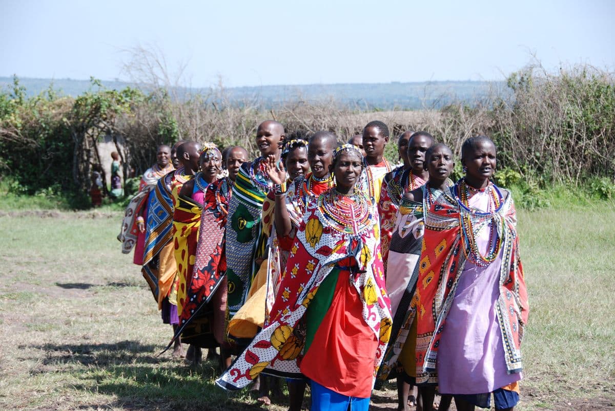 Maasai women wearing colorful beadwork and traditional clothing at a gathering in Kenya